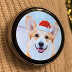 Lumipin photo pin showing a corgi in a Santa hat, worn on a cream knit sweater